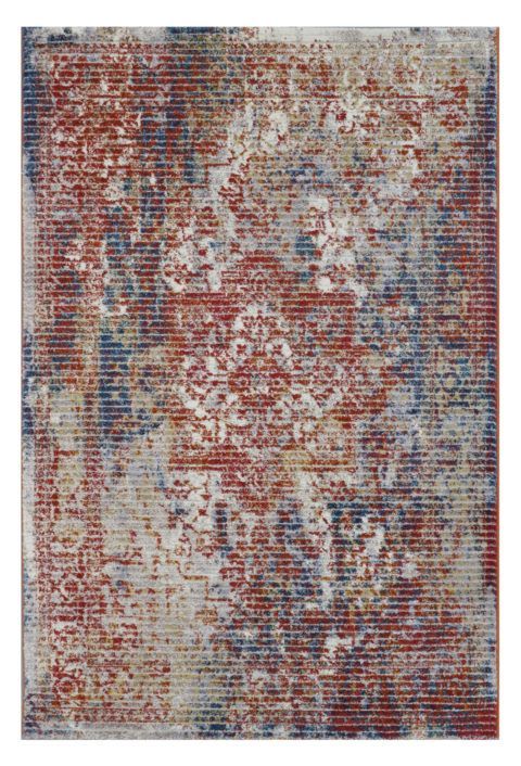 Monivärinen, sini-punasävyinen Vivia Trista-matto. Pinta on kuluneen näköinen. Matossa on raidallinen pintastruktuuri.